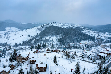 Fototapeta na wymiar panorama of a snowy mountainous landscape in the Bukovel region during the winter, Ukraine