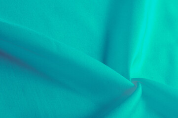 Bright turquoise silk chiffon, fluttering in the wind like a daisy, shines like heaven. Smooth hand...