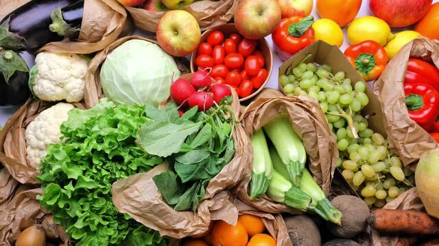 healthy colorful products in eco paper bags with organic fresh harvest from the farm, fresh vitamin rich groceries. Balanced diet concept. Shopping food supermarket, healthy eating, nutrition plan. Se