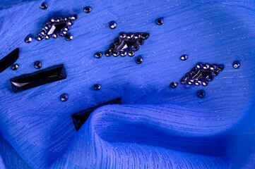 Background design texture, silk pattern, blue fabric with glued