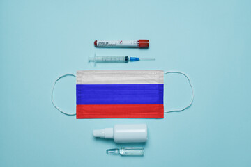 Blood tube for test detection of virus Covid-19 Omicron Variant with positive result, medicine mask with Romania flag superimposed and vaccine.  New Variant of the Covid-19 Omicron - 476740672