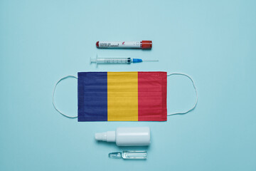 Blood tube for test detection of virus Covid-19 Omicron Variant with positive result, medicine mask with Romania flag superimposed and vaccine.  New Variant of the Covid-19 Omicron - 476740686