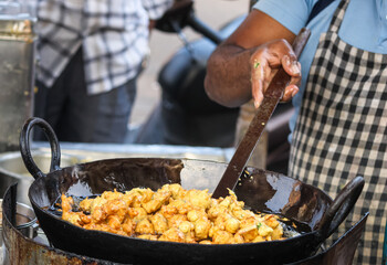 The Man Making a Bhajji [Pakodas]
