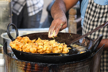 The Man Making a Bhajji [Pakodas]