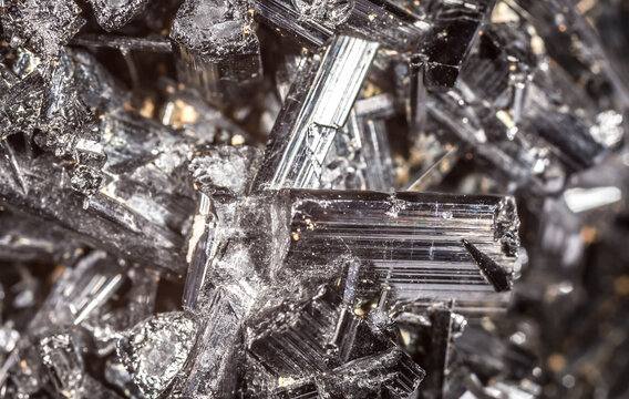 Tourmaline black crystals. Gems. Mineral crystals in the natural environment. Texture of precious and semiprecious stones. Seamless background with copy space colored shiny surface of precious stones.