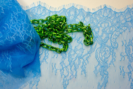 Blue lace on a white background. black lace trim around the yard. fabric for underwear. crochet trim. your design. postcard invitation. texture background pattern