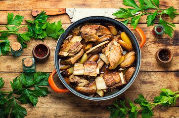 Delicious beef ribs with baked potatoes.