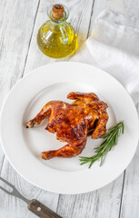 Roasted chicken on the white plate