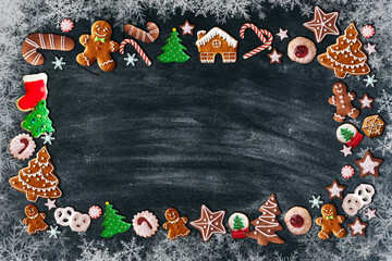 Christmas background with ginger bread cookies figurines specific for winter season