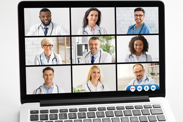 Fototapeta na wymiar Laptop With Group Video Call Of Diverse Doctors, White Background