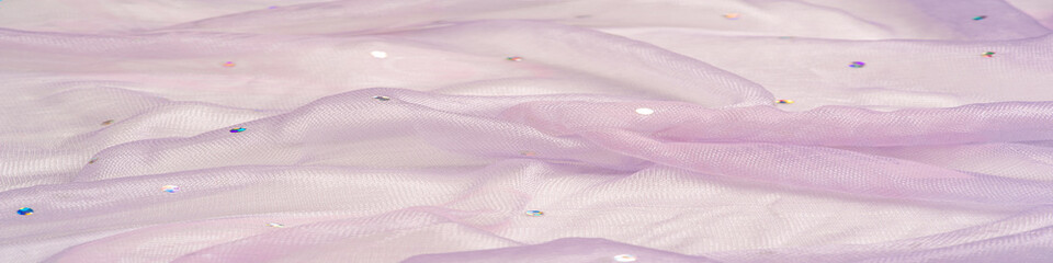 transparent pale pink fabric with color glitter, known for its library of classic and modern design. texture, background