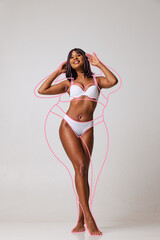 Happy young adorable slim woman in underwear isolated over gray background. Line art. Modern artwork. Healthy eating concept