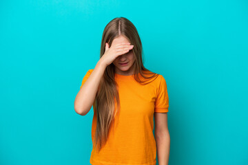 Young Russian woman isolated on blue background with headache