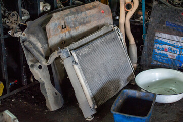 A mess in the garage. The workplace is in disarray. Keys and auto parts are scattered throughout the area. 18 07 2021 Ustkaman Kazakhstan