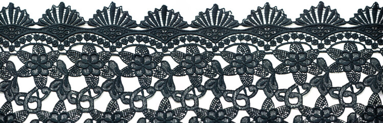 Lace fabric in black. Pure cotton lace with floral pattern embellished with embroidery. Light Transparency. Textured. Background. Pattern
