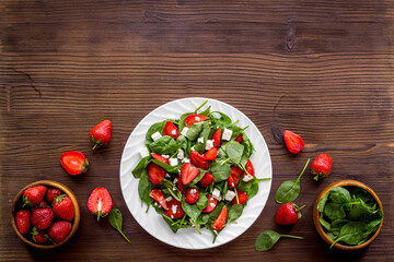 Healthy spinach salad with strawberry. Vegetarian lunch
