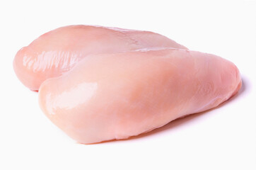 Whole raw chicken breast isolated on a white background