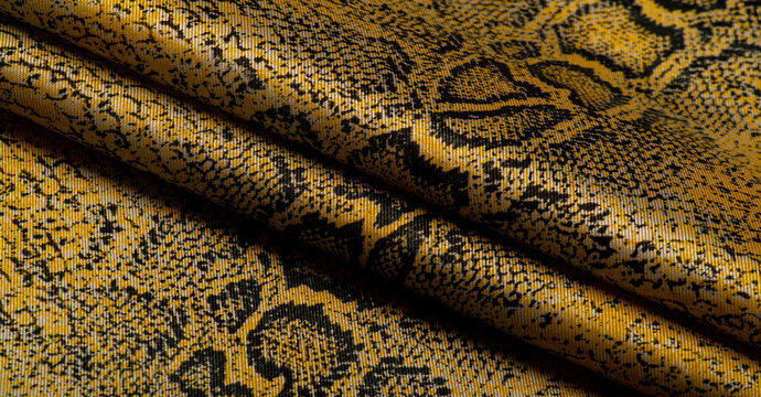 fabric with a pattern of yellow snake skin, African fabric, designer photo - safari in the country of Africa. Texture
