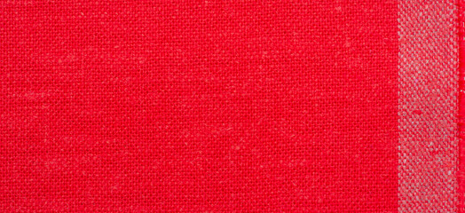 Linen fabric in red. Linen fabric is considered luxurious because processing it from the flax plant...
