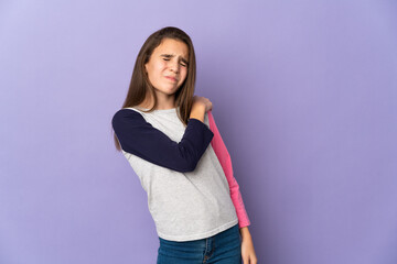 Little girl isolated on purple background suffering from pain in shoulder for having made an effort