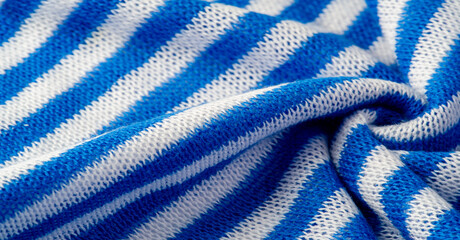 White and blue stripe fabric. Knitted fabric is a fabric that is obtained as a result of knitting,...