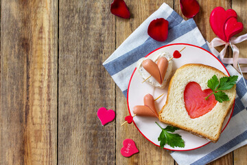 Breakfast for valentine's day or mother's day. Toast with salmon and cheese with the inscription that I love you, on a rustic table.  ​Top view flat lay. Copy space.