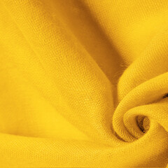 Texture. Background fabric of silk yellow matte color (paint or surface) is dull and flat, without shine.