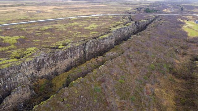 Flying drone over canyon in national park Thingvellir, Iceland, autumn landscape