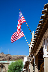 American flags waving in blue sky