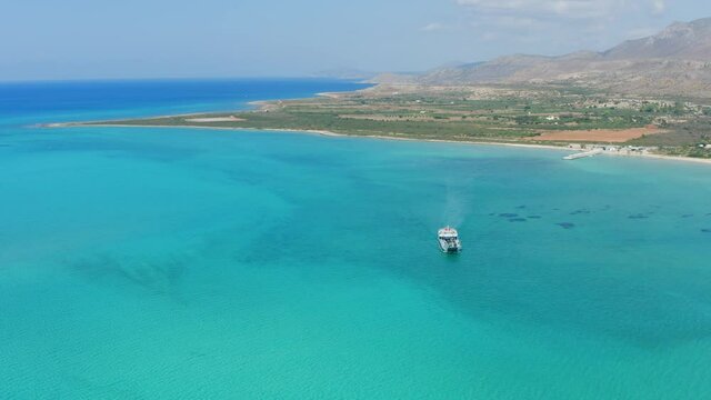 Ferry departing from Pounta Lakonia, aerial drone view. Destination Elafonisos island. Peloponnese. Greece. 