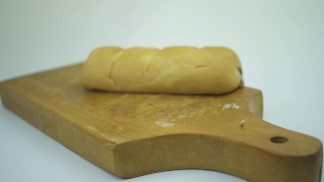 footage of bread and puff rice over the wooden board with white background. That footage perfect for food pamphlet, product poster, product promotion and ads.