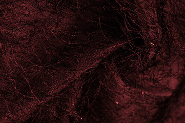Red silk fabric in burgundy color with sequins and yarns on the surface of the fabric. This ombre tulle in red with abstract embroidery, embellished with sequins and yarns from a European designer