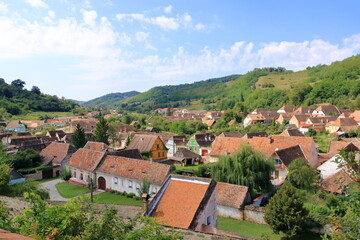 Fototapeta na wymiar The village of Biertan, (Birthälm) and surrounding landscape, Sibiu County, Romania. Seen from the fortified church of Biertan, which is a UNESCO World Heritage Site.