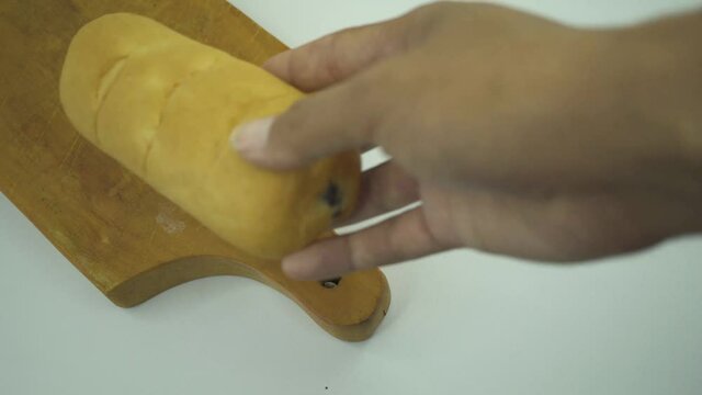 footage of bread and puff rice over the wooden board with white background. That footage perfect for food pamphlet, product poster, product promotion and ads.