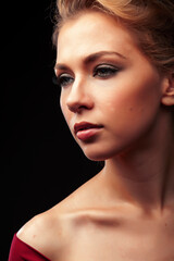 young sensual blond woman posing on black background, lifestyle people concept