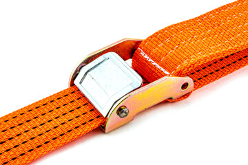 Truck strap lock in orange nylon and metal tie isolated over white background. Ratchet straps for...