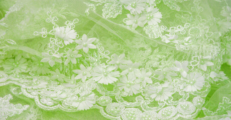 The lace is soft green. Texture. background. template. abstract background with pale green rod, old lace and salad lines. can be used for postcard, poster, texture or wallpaper