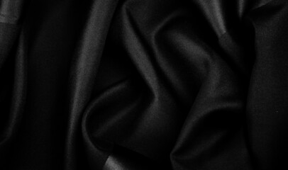 black silk fabric, this is silk satin weaving. Differs in density, smoothness and gloss of the front side, softness, Texture, background