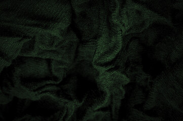 Coarse dark green woolen fabric. Sheep with long,   durable, coarse-fiber wool especially suited to your design. As with various large breeds of lamb. Texture background pattern