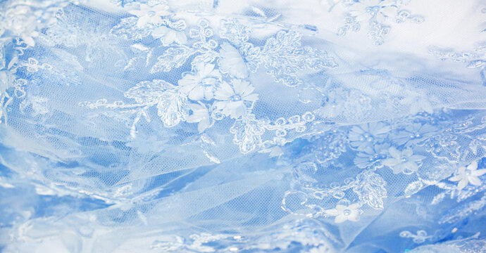 The lace is light blue. Texture. background. template. abstract background with pale blue rod, old lace and sapphire lines. can be used for postcard, poster, texture or wallpaper