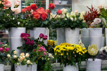 Fototapeta na wymiar floristic warehouse with fresh cut flower arrangements bouquets in the refrigerator