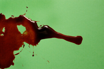 pool of red blood on green background