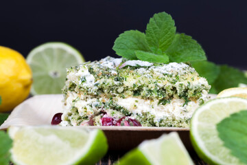green cake with cream and lime