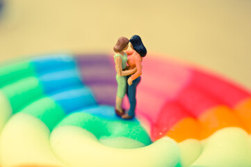 miniature figurines of a gay couple and rainbow colors