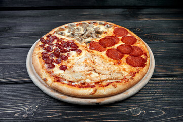 Top view of Pizza Margherita on black background. Classic Italian Pizza Margarita with Tomato sause, Basil and Mozzarella Cheese