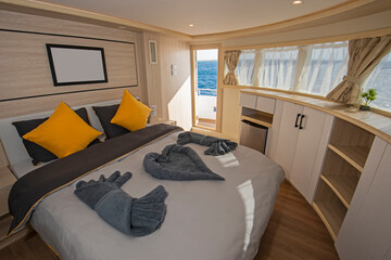 Interior of large suite cabin on luxury yacht