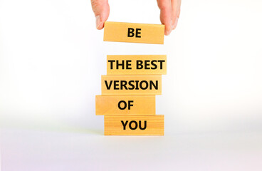 Best version of you symbol. Wooden blocks with words Be the best version of you on beautiful white background, copy space. Businessman hand. Business, best version of you concept.