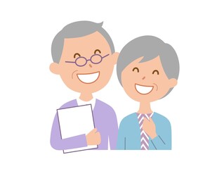 Obraz premium 本を抱えた、笑顔のシニア夫婦