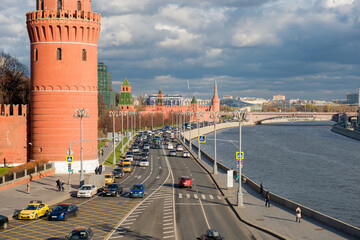 View of the Moscow Kremlin and car traffic along the Kremlin Embankment of Moscow River  on a...