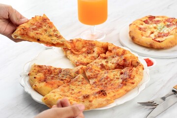 Pizza with Melted Cheese on Top, A Girl Take on Slice Pizza. Served on White Plate, Concept White Bakery